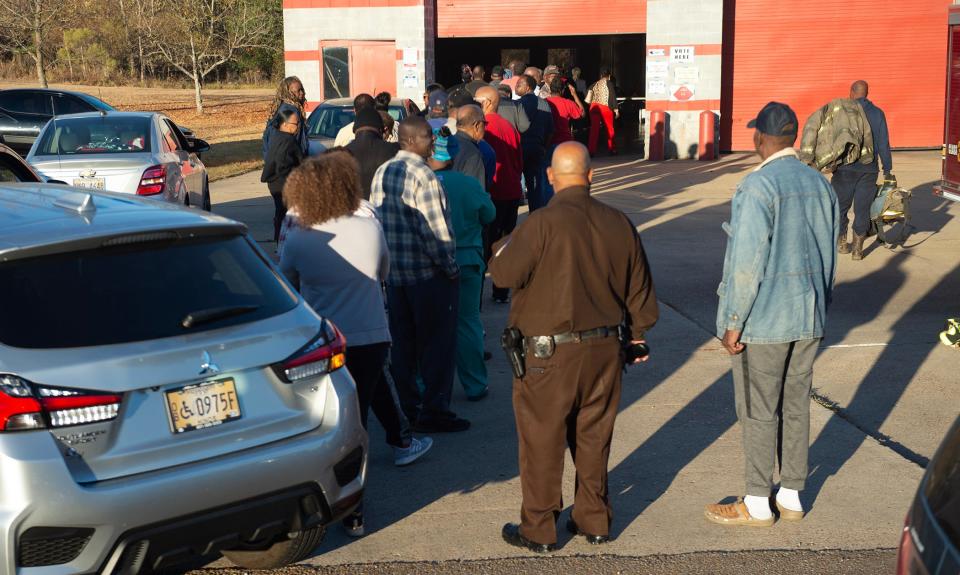 Voters line up to cast their ballots on Election Day at Precinct 84 at Jackson Fire Station 26 in Jackson, Miss., Tuesday, Nov. 7, 2023.