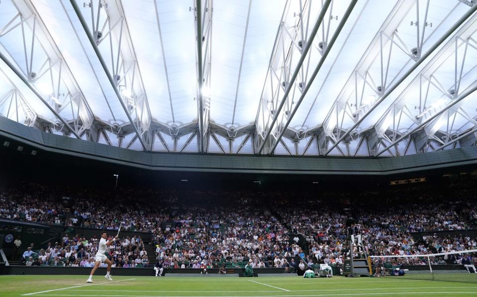 Novak Djokovic playing under the roof during his Gentlemen's Singles fourth round match against Tim van Rijthoven - Adam Davy/PA Wire