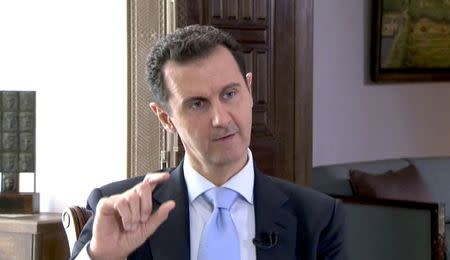 Syrian President Bashar al-Assad speaks during a TV interview in Damascus, Syria in this still image taken from a video on November 29, 2015. REUTERS/Reuters TV courtesy of Czech Television
