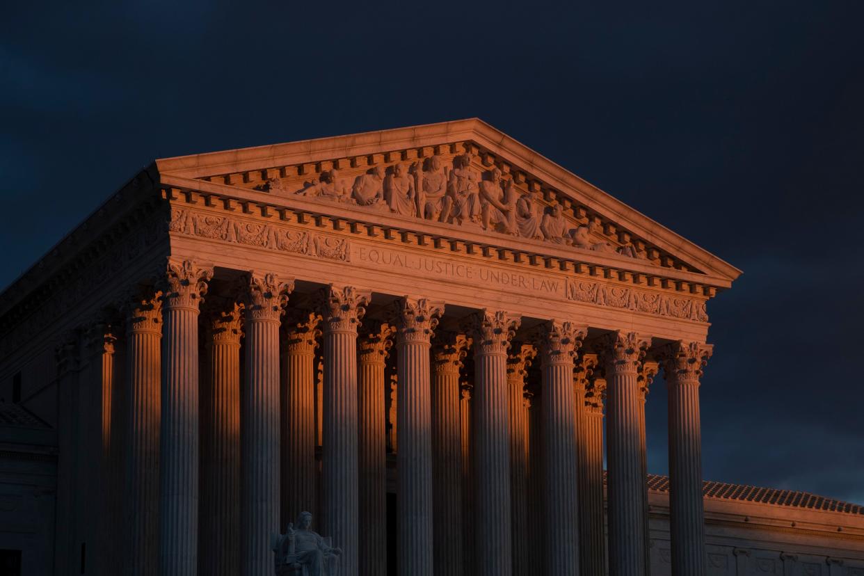 FILE - The Supreme Court is seen at sunset in Washington, on Jan. 24, 2019. The Supreme Court will be taking its first look in the 156-year history of the 14th Amendment at a provision, Section 3, that's meant to keep former officeholders who "engaged in insurrection" from ever  regaining power. The stakes couldn't be higher in arguments taking place on Thursday, Feb. 8, 2024. (AP Photo/J. Scott Applewhite, File) ORG XMIT: WX204