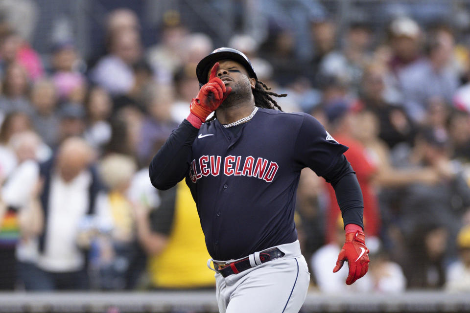 Cleveland Guardians' Josh Bell gestures towards the sky as he nears home plate after hitting a solo home run against the San Diego Padres in the second inning of a baseball game Tuesday, June 13, 2023, in San Diego. (AP Photo/Derrick Tuskan)
