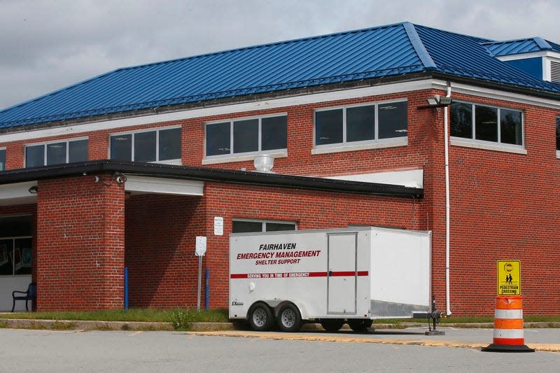 A Fairhaven Fire Department Shelter Support trailer is parked in front of the Hastings Middle School in Fairhaven.