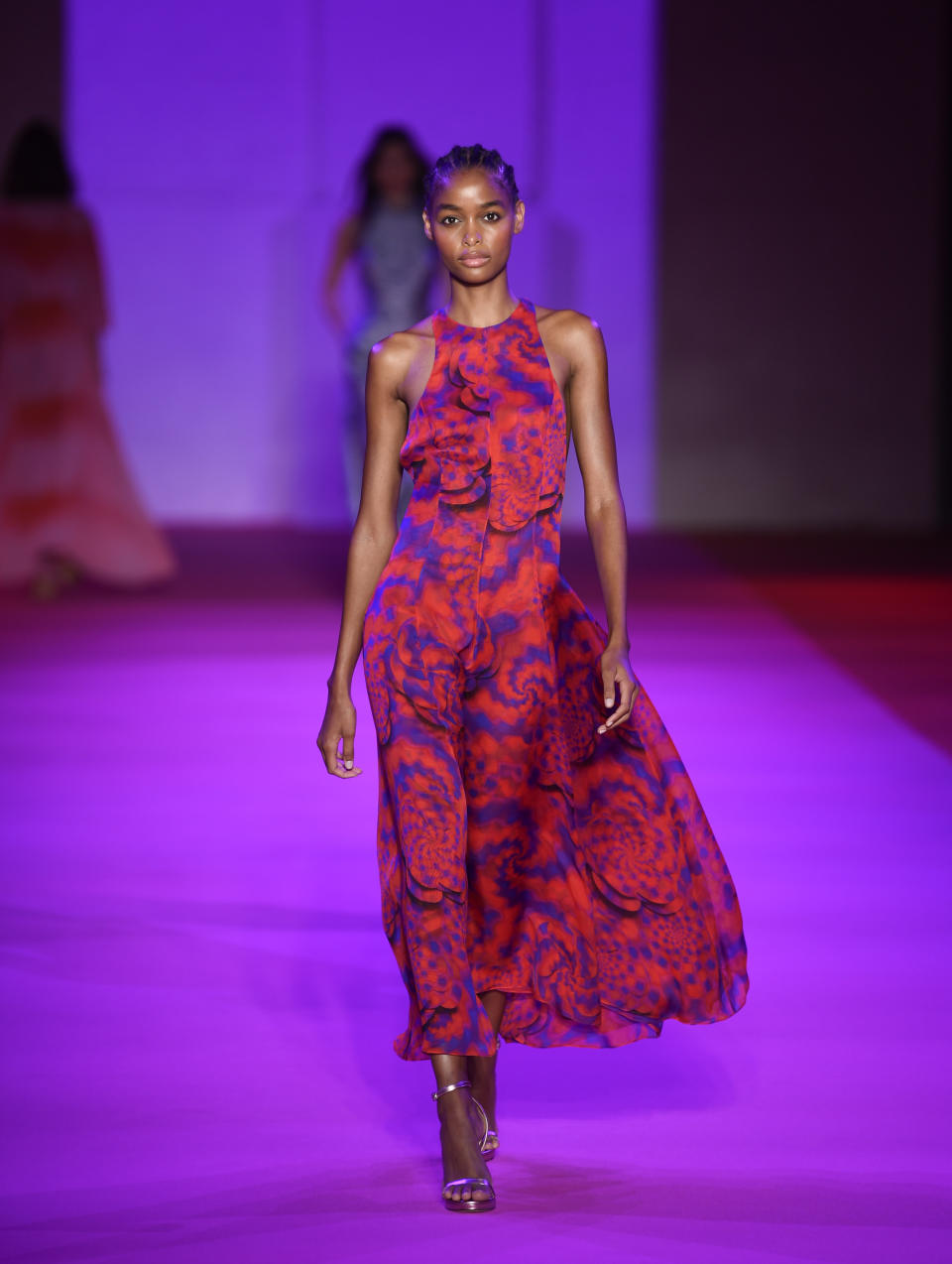 A model walks the runway at the Brandon Maxwell spring/summer 2022 fashion show in the Brooklyn borough of New York during Fashion Week on Friday, Sept. 10, 2021. (Photo by Evan Agostini/Invision/AP)