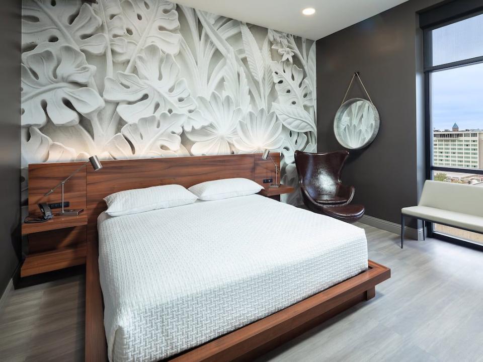 guest room with wooden headboard