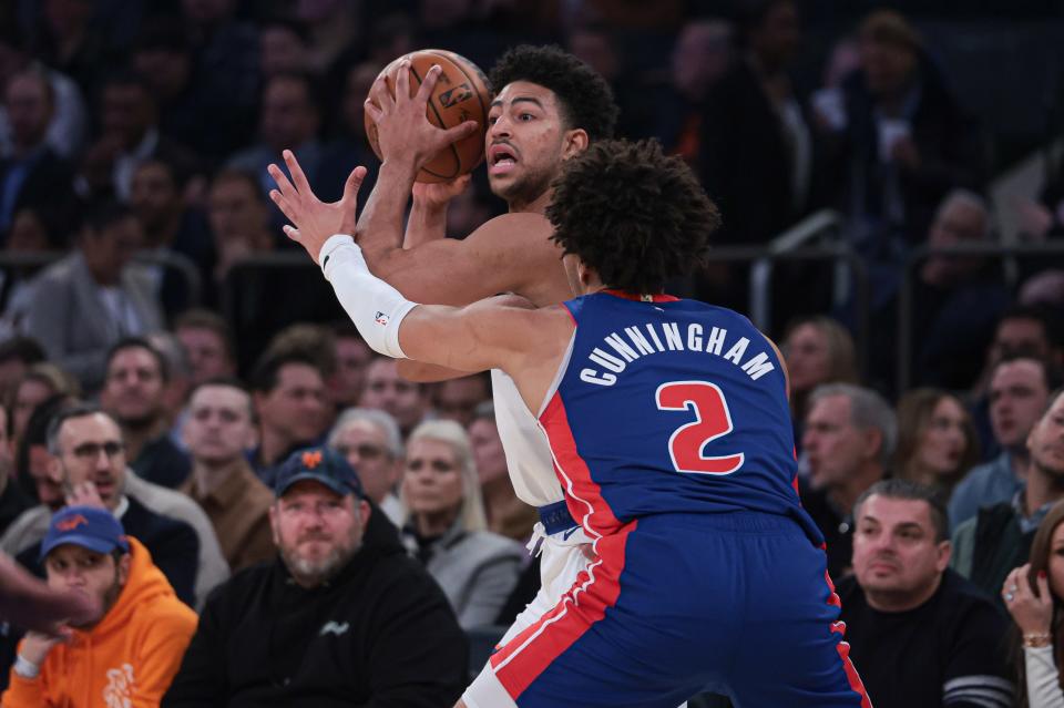 New York Knicks guard Quentin Grimes (6) looks to pass as Detroit Pistons guard Cade Cunningham (2) defends during the first half at Madison Square Garden in New York on Thursday, Nov. 30, 2023.