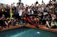 Formula One F1 - Monaco Grand Prix - Circuit de Monaco, Monte Carlo, Monaco - May 27, 2018 Red Bull's Daniel Ricciardo jumps into a pool as he celebrates winning the race REUTERS/Benoit Tessier