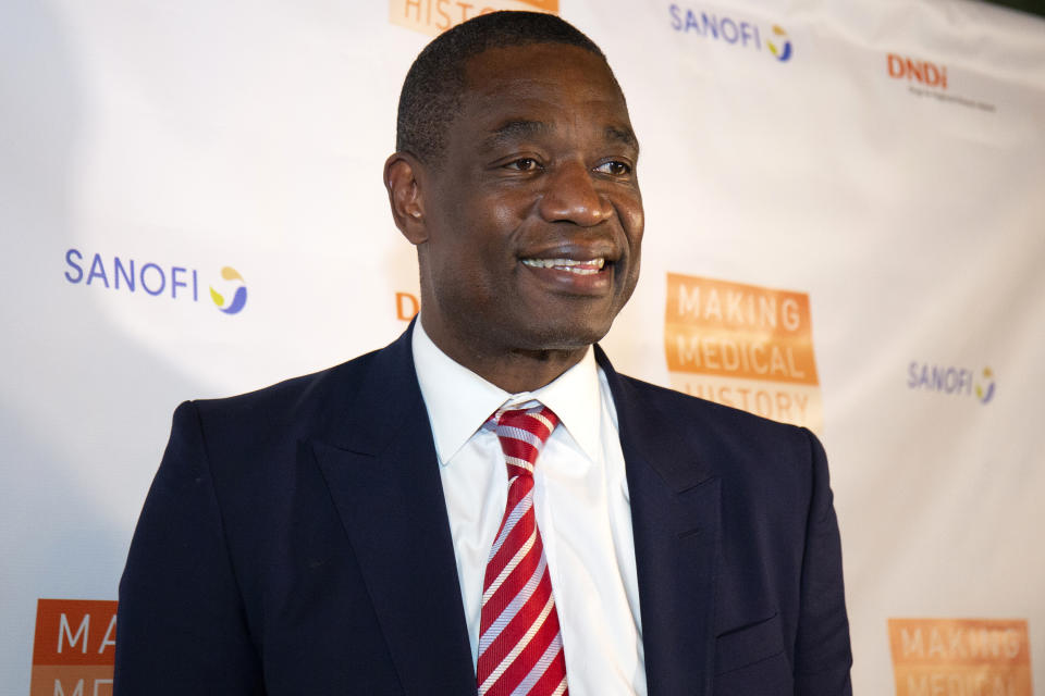 Dikembe Mutombo is changing the life of a young boy who has been shunned by society due to the large tumor on his face. (Santiago Felipe/Getty Images)