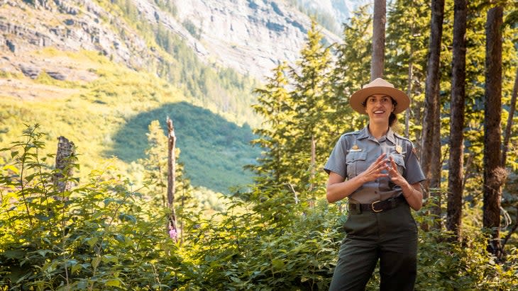 <span class="article__caption">Rangers and other experts lead hikes and educational events all season. Here a ranger takes visitors on a hike to Avalanche Lake, Glacier National Park, Montana.</span> (Photo: Glacier NPS)