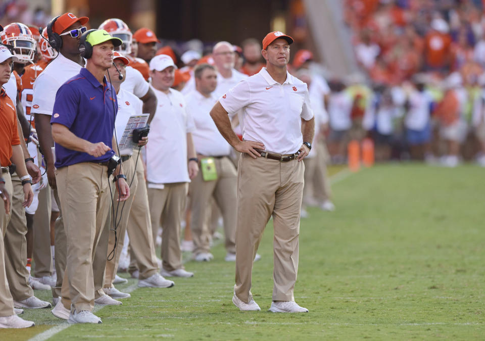 Clemson head coach Dabo Swinney, center, and defensive coach Brent Venables, left, watch the action during the second half against Texas A&M on Sept. 7, 2019. (AP)