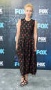 <p> A chic floral midi dress should be part of every capsule wardrobe as it can be dressed up, down or layered on top of other clothes, depending on the season. Anderson demonstrated how to elevate this versatile style into a glam red carpet look at a FOX event in New York in 2017. She paired a black short-sleeved frock, featuring red flower detailing, with an elegant updo and strappy black heels. </p>