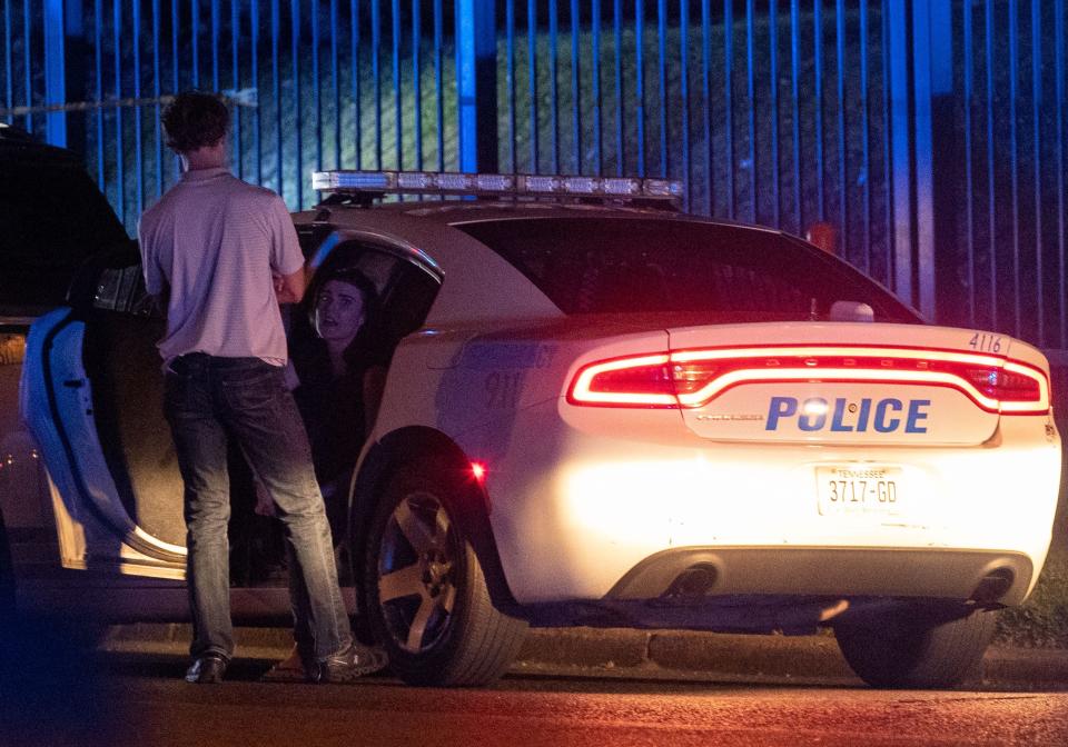 Memphis police officers work the scene of a shooting MPD believes was committed by a man driving around shooting Wednesday, Sept. 7, 2022, near the intersection of Auburndale Street and Poplar Avenue. 