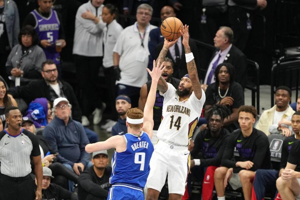 New Orleans Pelicans forward Brandon Ingram (14) shoots against Sacramento Kings guard Kevin Huerter (9) during the third quarter on Dec. 4, 2023, at Golden 1 Center.