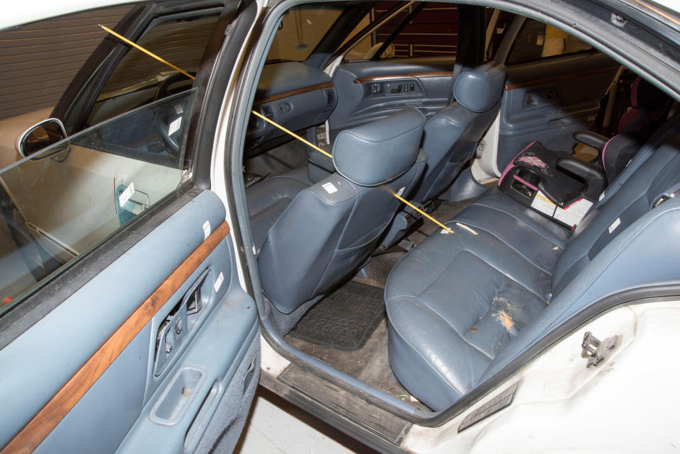 The trajectory of where a bullet became lodged next to a child's chair in the rear seat of the car.