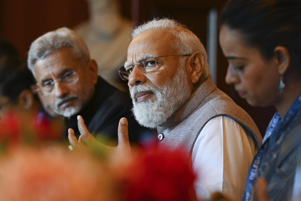 India's Prime Minister Narendra Modi, center, gestures as he speaks during a bilateral meeting at Admiralty House in Sydney, Australia, Wednesday, May 24, 2023. Modi is the only leader of the so-called Quad nations to continue with his scheduled visit to Australia after U.S. President Joe Biden pulled out of a planned meeting of the group in Sydney to return to Washington to focus on debt limit talks. (Dean Lewins/Pool Photo via AP)