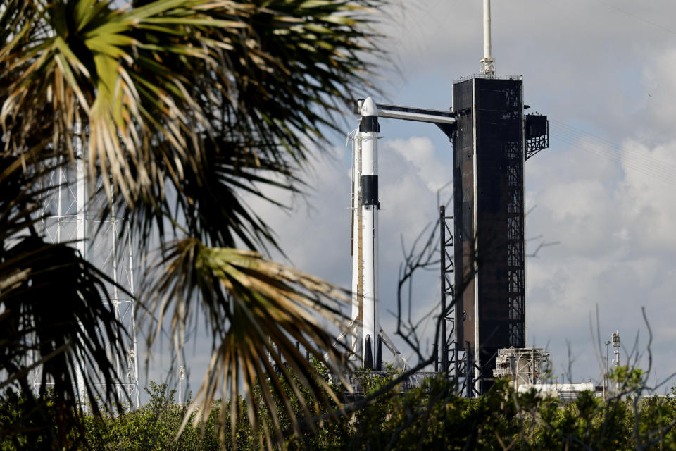 A SpaceX Falcon 9 rocket, with the Crew Dragon spacecraft, stands ready for launch to the International Space Station on pad 39A at the Kennedy Space Center in Cape Canaveral, Fla., Sunday, May 21, 2023. (AP Photo/Terry Renna)