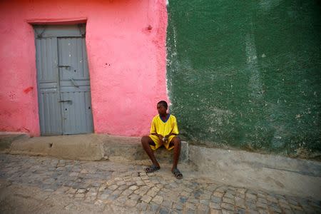 A boy sits in front of his house within the walled city of Harar, Ethiopia, February 24, 2017. REUTERS/Tiksa Negeri