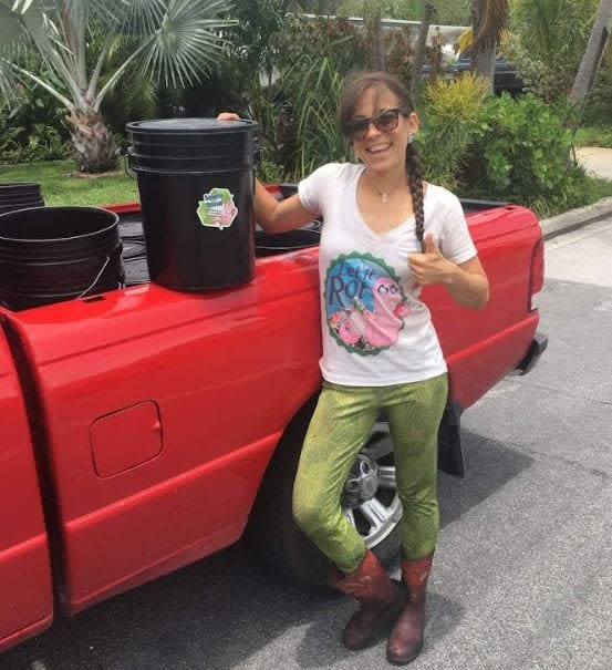 Melissa Corichi, who founded the small business Let it Rot, with one of the collection buckets she used to pick up food scraps from clients.