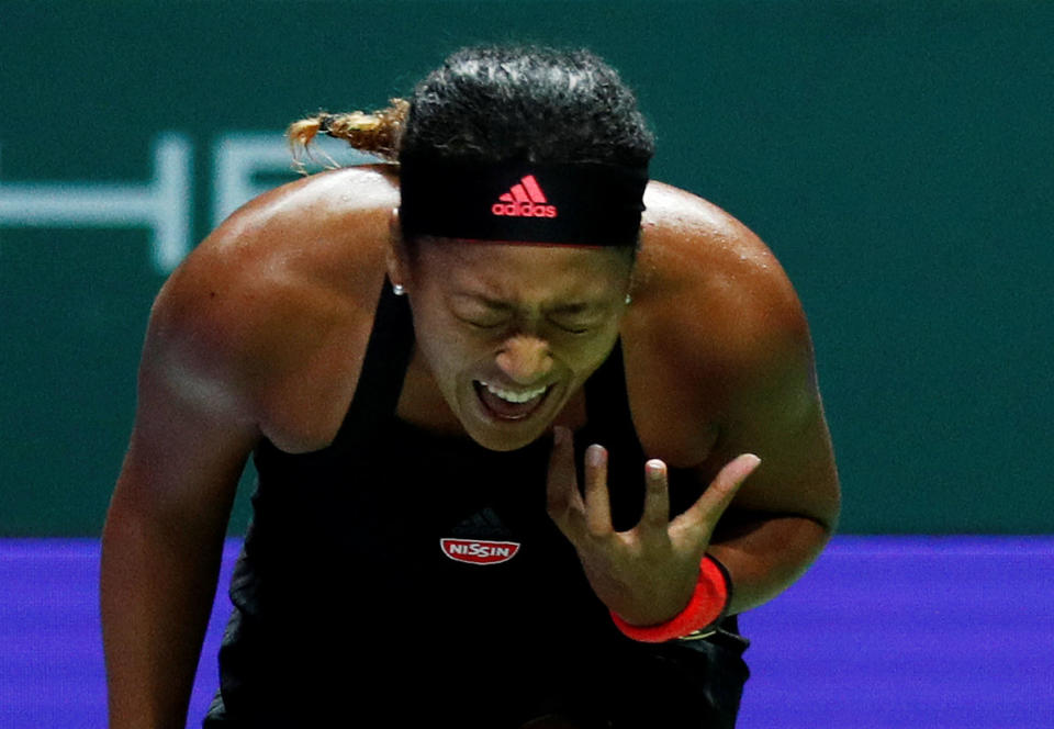 Naomi Osaka screams in frustration after losing a point during her match against Angelique Kerber at the WTA Finals Singapore. (PHOTO: Reuters/Edgar Su)