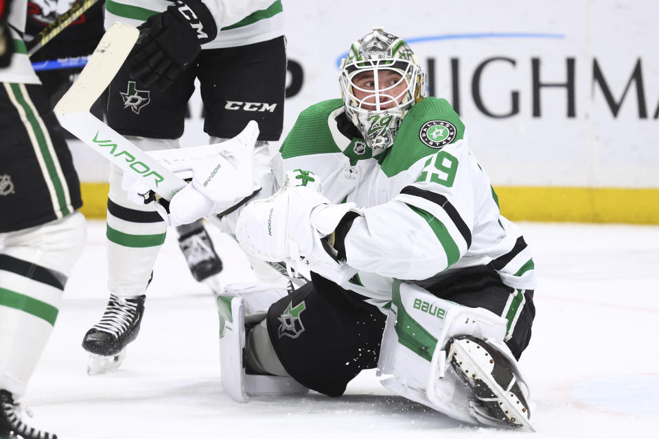 Dallas Stars goaltender Jake Oettinger watches the puck go wide during the first period of the team's NHL hockey game against the Buffalo Sabres on Tuesday, Feb. 6, 2024, in Buffalo, N.Y. (AP Photo/Jeffrey T. Barnes)