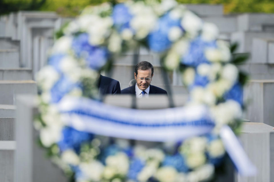 Israeli President Isaac Herzog attends a wreath laying ceremony at the Holocaust memorial in Berlin, Germany, Tuesday, Sept. 6, 2022. Israeli President Isaac Herzog has addressed Germany’s parliament about atrocities committed during the Third Reich. But Herzog did use his speech Tuesday at the Bundestag to praise the close and friendly relations that have emerged between the two countries since the end of the Holocaust. Six million European Jews were murdered by Germany’s Nazis and their henchmen during World War II. (AP Photo/Christoph Soeder)
