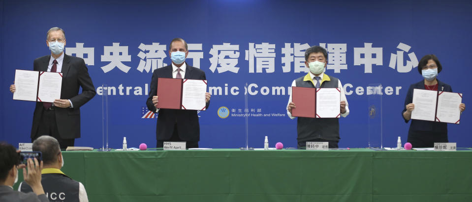 From left; Director of the American Institute in Taiwan (AIT) William Brent Christensen, U.S. Health and Human Services Secretary Alex Azar, Taiwanese Minister of Health and Welfare Chen Shih-chung and Director-General of Bureau of Foreign Trade Yang Jen-ni pose for a photo during a memorandum of understanding signing ceremony at the Central Epidemic Command Center in Taipei, Taiwan, Monday, Aug. 10, 2020. Azar arrived in Taiwan on Sunday in the highest-level visit by an American Cabinet official since the break in formal diplomatic relations between Washington and Taipei in 1979. (AP Photo/Chiang Ying-ying)