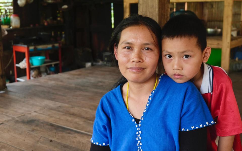 Sunaree Khamlaa, 32, and her son Thanakrit Phatchi, 6, who goes to a school in Pa Tung Ngam where 'green zones' have been set up - Sarah Newey