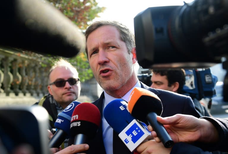 Wallonia leader Paul Magnette (C) answers journalists' questions as he arrives for an emergency meeting of all Belgium federal entities on the EU-Canada Comprehensive Economic and Trade Agreement (CETA) in Brussels on October 26, 2016