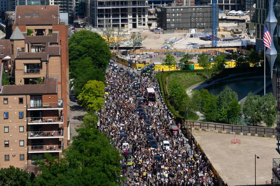 Demonstrators block the road as they gather outside the US Embassy in London on May 31, 2020 to protest the death of George Floyd, an unarmed black man who died after a police officer knelt on his neck for nearly nine minutes during an arrest in Minneapolis, USA. - Hundreds gathered in central London and marched to teh US Embassy to protest the death of an unarmed black man in Minneapolis while in police custody that has sparked days of unrest in the US city and beyond. (Photo by JUSTIN TALLIS / AFP) / The erroneous mention[s] appearing in the metadata of this photo by JUSTIN TALLIS has been modified in AFP systems in the following manner: [London] instead of [Brighton]. Please immediately remove the erroneous mention[s] from all your online services and delete it (them) from your servers. If you have been authorized by AFP to distribute it (them) to third parties, please ensure that the same actions are carried out by them. Failure to promptly comply with these instructions will entail liability on your part for any continued or post notification usage. Therefore we thank you very much for all your attention and prompt action. We are sorry for the inconvenience this notification may cause and remain at your disposal for any further information you may require. (Photo by JUSTIN TALLIS/AFP via Getty Images)