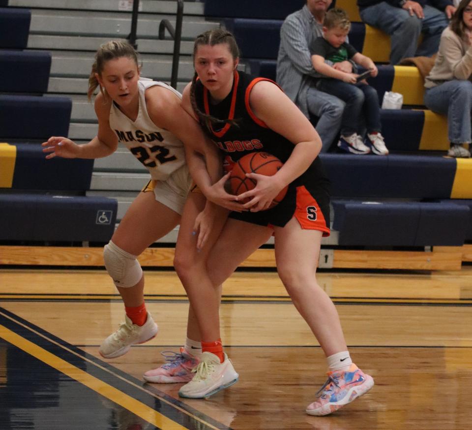 Abby Haller (left) of Summerfield wrestles for the ball with Erie Mason’s Kaylee Bash Friday night during a 58-31 Summerfield win.