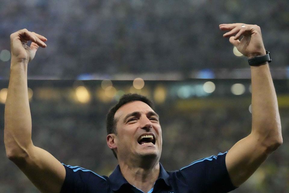 FILE - Argentina's head coach Lionel Scaloni celebrates his team's win after the World Cup final soccer match between Argentina and France at the Lusail Stadium in Lusail, Qatar, Dec. 18, 2022. Scaloni signed a contract extension to remain in charge of Argentina's national team until the 2026 World Cup. (AP Photo/Frank Augstein, File)