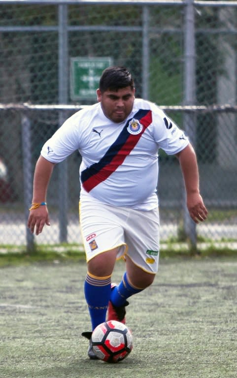 A member of the Galaxy soccer team controls the ball during a match designed to promote weight loss in Mexico