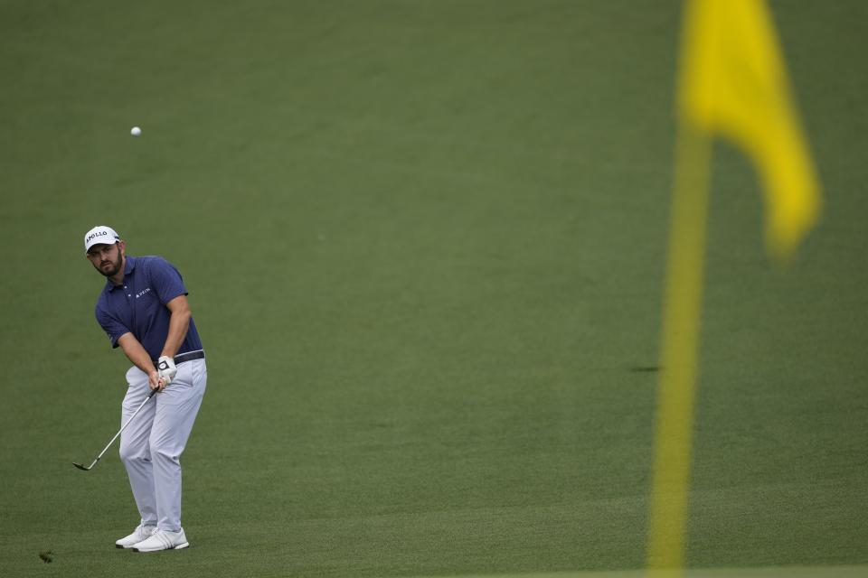 Patrick Cantlay chips to the green on the second hole during the first round at the Masters golf tournament at Augusta National Golf Club Thursday, April 11, 2024, in Augusta, Ga. (AP Photo/David J. Phillip)