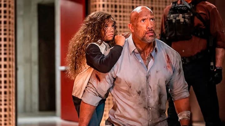 McKenna Roberts and Dwayne Johnson in Skyscraper.