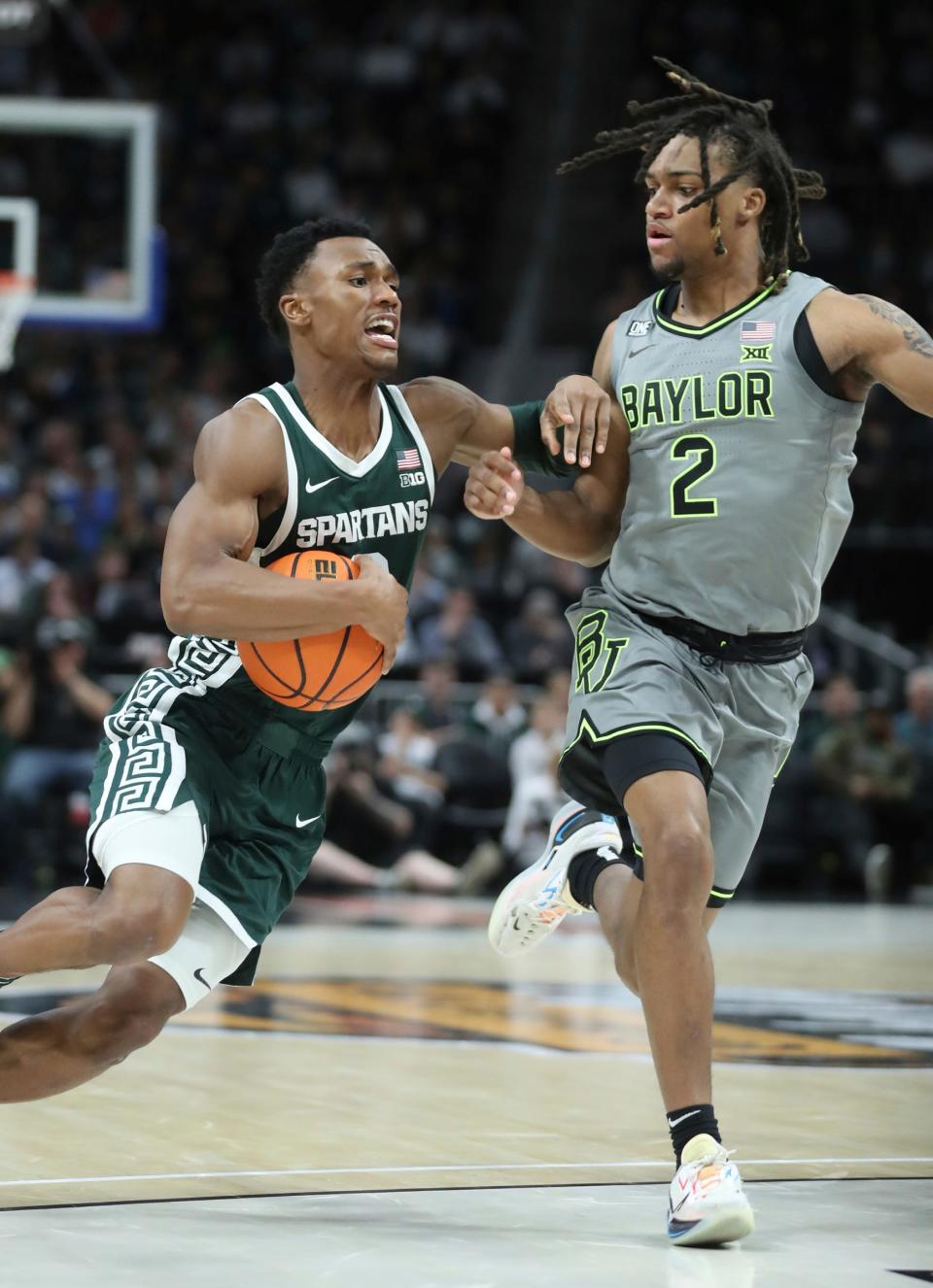 Michigan State guard Tyson Walker drives against Baylor guard Jayden Nunn during the second half of MSU's 88-64 win over Baylor on Saturday, Dec.16, 2023, at Little Caesars Arena.