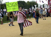 <p>A man carries a sign as he walks through a rally on the National Mall in Washington, Saturday, Sept. 16, 2017, in support of President Donald Trump in what organizers are calling ‘The Mother of All Rallies.” (Photo: Susan Walsh/AP) </p>