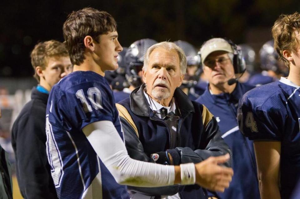 Longtime Charlotte Latin football coach Larry McNulty (right) coached both Daniel Jones (left) and then his younger brother Bates Jones. Both played quarterback for McNulty, but only Bates Jones - now a basketball player at Duke - won a state championship.