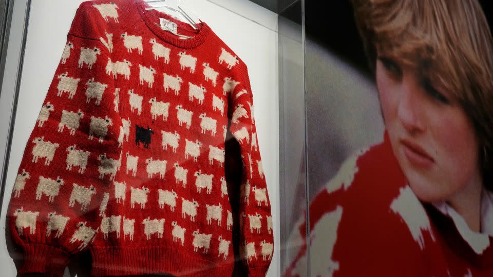 Princess Diana's iconic black sheep jumper on display at Sotheby's in London on July 17, 2023. - Frank Augstein/AP