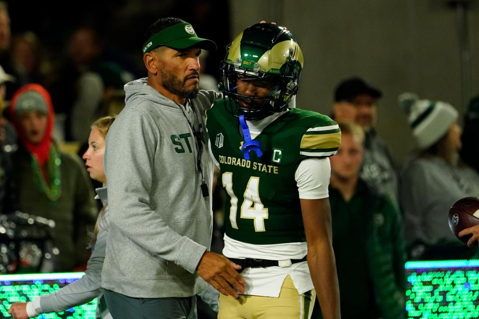 Colorado State coach Jay Norvell hugs wide receiver Tory Horton during warmups before a game last October. Horton is the Rams' most explosive offensive player, with 167 catches for 2,267 yards and 16 touchdowns in the past two seasons.