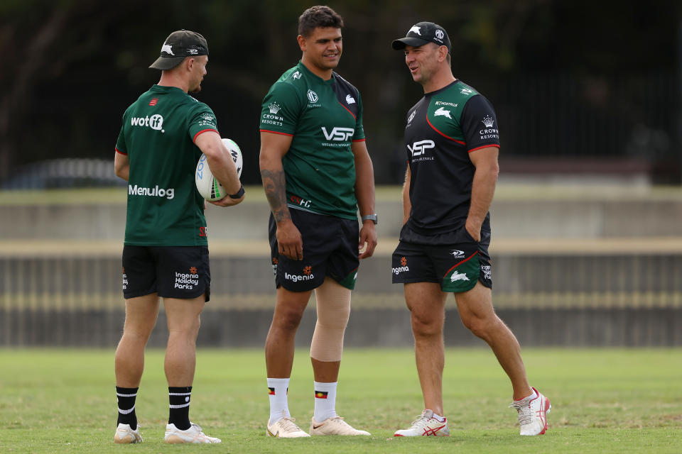 Latrell Mitchell, pictured here speaking to head coach Jason Demetriou during a South Sydney Rabbitohs training session.