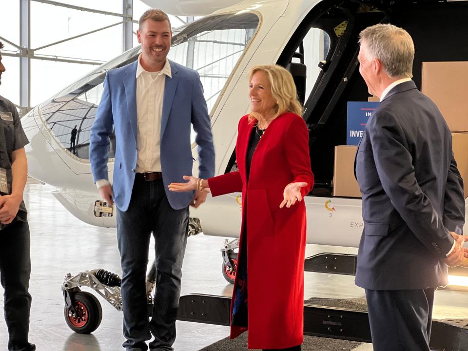 First Lady Jill Biden talks with BETA Technologies CEO Kyle Clark and a couple of BETA interns as well as Governor Phil Scott as they stand in front of one of BETA's electric aircraft on April 5, 2023.