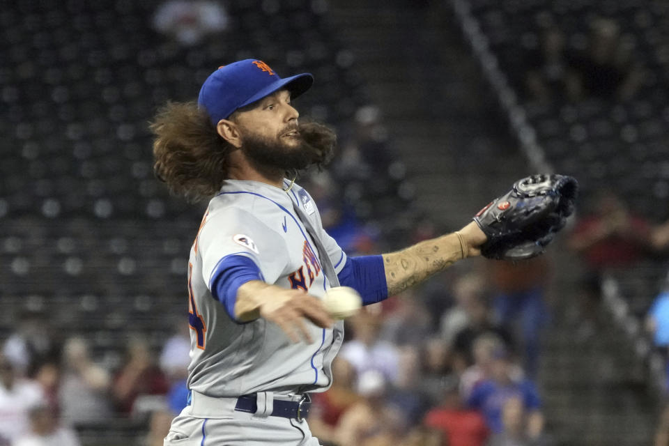 New York Mets pitcher Robert Gsellman makes the play for an out on a ball hit by Arizona Diamondbacks' Ildemaro Vargas in the third inning during a baseball game, Wednesday, June 2, 2021, in Phoenix. (AP Photo/Rick Scuteri)