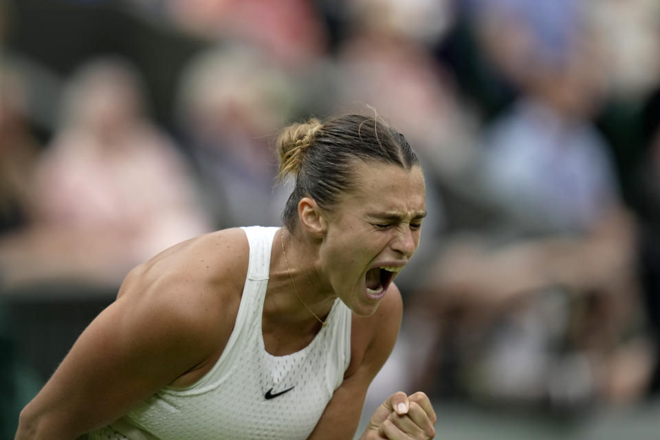 Aryna Sabalenka of Belarus celebrates winning the first set against Tunisia's Ons Jabeur during their women's semifinal singles match on day eleven of the Wimbledon tennis championships in London, Thursday, July 13, 2023. (AP Photo/Kin Cheung)