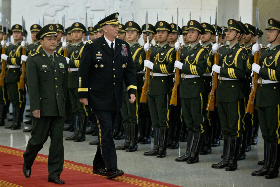 U.S. Army Chief of Staff Gen. Raymond Odierno, front right and Gen. Wang Ning, front left, deputy Chief Staff of the People's Liberation Army (PLA), review an honor guard at China's Ministry of Defense in Beijing, Friday, Feb. 21, 2014. The U.S. Army chief met with top Chinese generals in Beijing Friday amid regional tensions and efforts to build trust between the two nation's militaries. (AP Photo/Alexander F. Yuan, Pool)