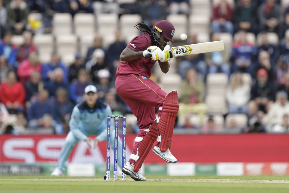 West Indies' Chris Gayle avoids a bouncer during the Cricket World Cup match between England and West Indies at the Hampshire Bowl in Southampton, England, Friday, June 14, 2019. (AP Photo/Matt Dunham)