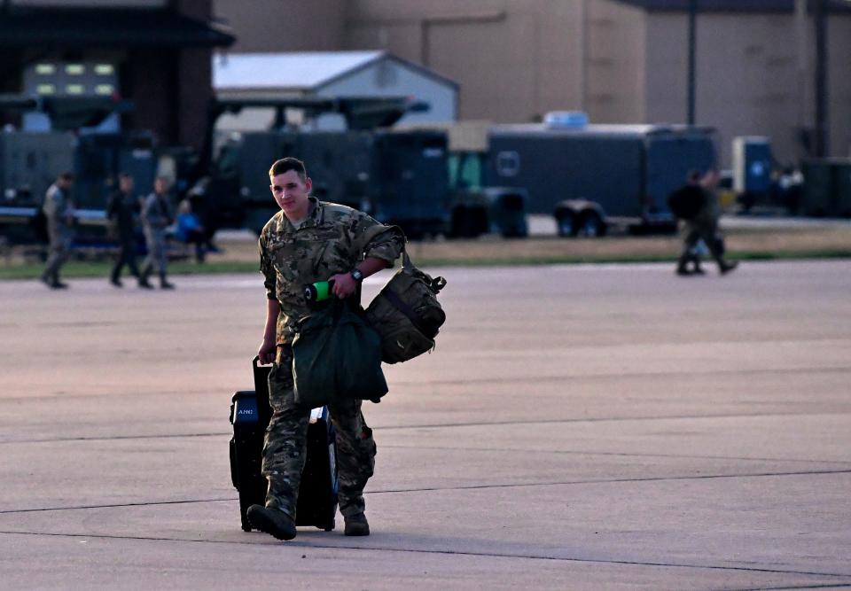 Airman 1st Class Tanner Huff brings his luggage and crew gear onto the C-130 flight line in 2019 at Dyess Air Force Base. The 39th Airlift Squadron deployed its largest number of aircraft to Afghanistan in over a decade.