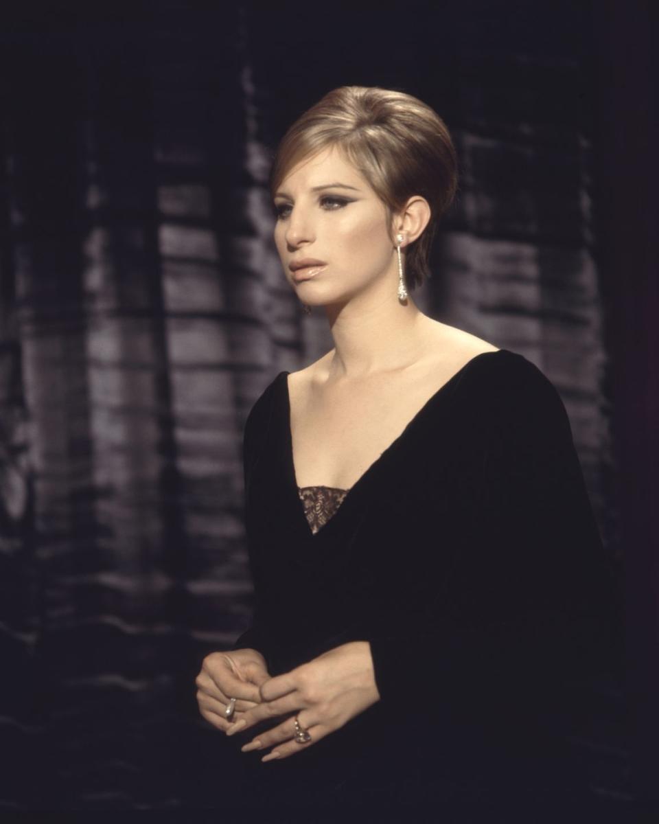 <p>Barbra Streisand's sleek bouffant and black gown make her diamond teardrop earrings the star of the show in this chilling performance of "My Man" in <em>Funny Girl</em>. </p>