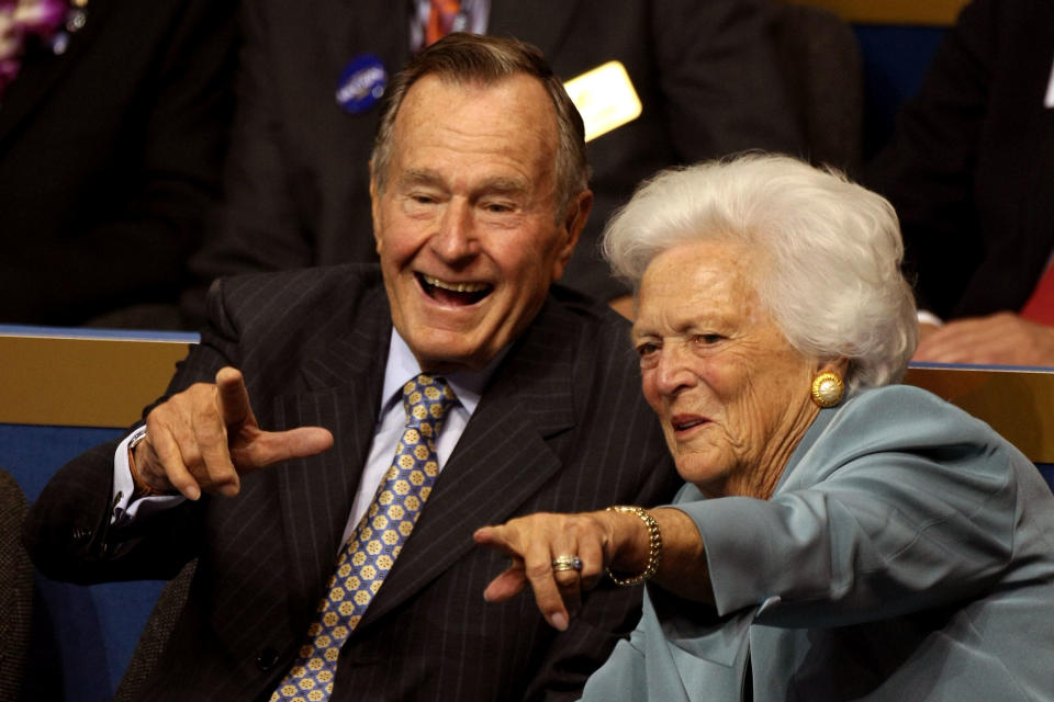 George H.W. and Barbara Bush point from their seats on day two of the Republican National Convention at the Xcel Energy Center on Sept. 2, 2008, in St. Paul, Minnesota.