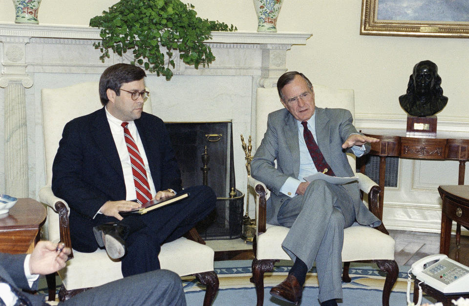 In 1992: President George H.W. Bush gestures while talking to Attorney General William Barr in the Oval Office. (Photo: Marcy Nighswander/AP)