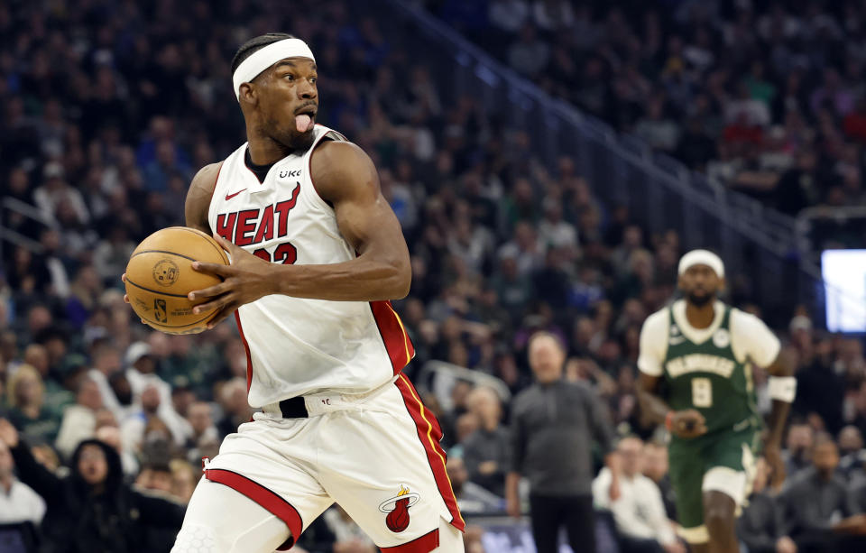 Miami Heat forward Jimmy Butler (22) breaks away for a dunk against the Milwaukee Bucks during the first half of Game 5 in a first-round NBA basketball playoff series Wednesday, April 26, 2023, in Milwaukee. (AP Photo/Jeffrey Phelps)