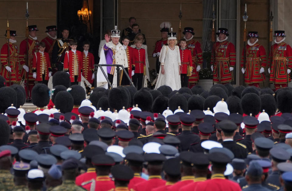 King Charles and Queen Camilla received the royal salute from military personnel at Buckingham Palace's west terrace on Saturday. (Dominic Lipinski/Pool via REUTERS)